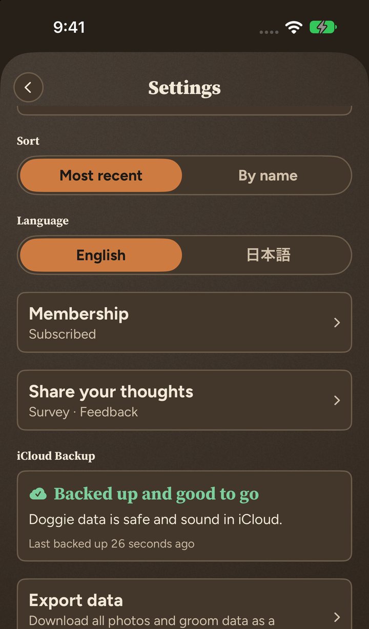 Settings in the Biscuit theme, dark: the green iCloud Backup card reads Backed up and good to go
